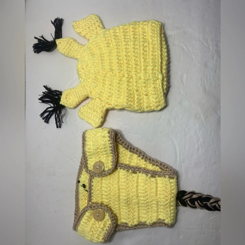 Crocheted baby giraffe outfit.
